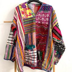 Gorgeous Handmade Baja Vintage (?) V-Neck Top In Bold Colorful Hues And Metallic Threading. Very “Free People” Style With The Carefree, Effortless, And Bold Vibe! - Single Off Center Pocket On Front Lower Area. - V Neck And Long Sleeves - Pull Over Boxy Oversized Poncho Style - Patchwork Design With Deconstructed Areas - Very Shabby Chic/Deconstructed Vibes. I’ve Captured The Loose Threading And Split Seams In The Photos, Please Take A Look. The Split Seams Are Easy To Repair Or Can Be Left For Charm! The Bold Pattern Camouflages Them So I Hope I Haven’t Missed Any. - B:24” L:28” Flat Measurements Advanced Style Boho, Jack Rogers Sandals, Free People Style, Advanced Style, Poncho Style, Beach Tops, Patchwork Designs, Colorful Boho, V Neck Tops