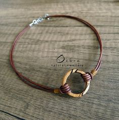 ★DESCRIPTION★ Spalted Beech Wood Circle Infinity/Karma Choker. Pendant Style Also Available (see photo) ★STYLE OPTIONS★ There are 2 styles of necklaces to choose from in drop down menu. Choker style or pendant style (see photos) The choker style also has 2 options, cords together (photo 1) or slightly apart (photo 5 mannequin)  There is a choice of either gemstone or wood. Click on drop down menu box and click on your choice There is a choice of leather or cotton. Click on other drop down menu a Earthy Hand Wrapped Jewelry For Everyday, Earthy Handmade Jewelry For Everyday, Earthy Hand Wrapped Everyday Jewelry, Adjustable Circle Wire Wrapped Jewelry, Unique Brown Jewelry For Everyday, Rustic Brown Jewelry With Adjustable Cord, Minimalist Brown Jewelry As A Gift, Minimalist Brown Jewelry For Gift, Minimalist Brown Jewelry As Gift