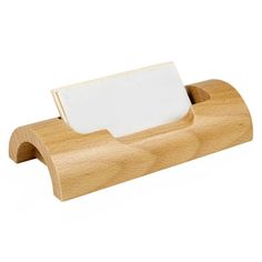 a wooden business card holder with a white paper on it's front and bottom