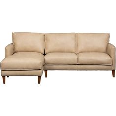 a beige couch sitting on top of a white floor