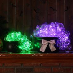 some lights that are sitting on a mantle