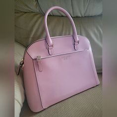 Pretty Pink Saffiano Dome Satchel For Spring! Gold Pin Hardware, Four Feet For Protection, External Zip Pocket In Front, Back Slip Pocket With Magnetic Snap Closure. Pink Satin Lining With Clover Logo. 12x9x5.5" Kept In Non-Smoking Home, Store In A Cloth Bag In The Closet. Elegant Pink Saffiano Leather Bag, Clover Logo, Kate Spade Disney, Bow Purse, Kate Spade Satchel, Gold Pin, In The Closet, Leather Satchel Bag, Cloth Bag