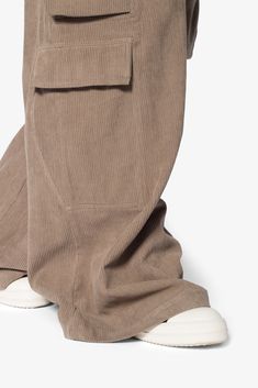 the Corduroy Rave Double Cargo Pants are designed with a new oversized rave fit, constructed from a cotton corduroy fabric, contrast drawcord, and finished with cargo pockets throughout. details ultra baggy fit throughout 100% cotton extended inseam model is 6’1, 140 lbs and wears a size 30 Winter Wide Leg Cotton Cargo Jeans, Wide-leg Corduroy Cargo Pants With Pockets, Wide Leg Corduroy Pants With Patch Pockets, Wide Leg Corduroy Cargo Pants With Pockets, Wide Leg Corduroy Cargo Pants, Utility Corduroy Bottoms For Streetwear, Corduroy Utility Bottoms For Streetwear, Utility Corduroy Cargo Pants For Fall, Corduroy Utility Cargo Pants For Fall