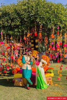 Mehendi Decor - Hanging Pom Poms From Tree Decor | WedMeGood  #wedmegood #indianwedding #indianbride #indiangroom #decor #mehendidecor #diy #hanging Mehendi Decorations, Pelli Decoration, Mehendi Decoration, Pohela Boishakh, Arabian Party, Small Stage, Sangeet Decor, Hall Decorations