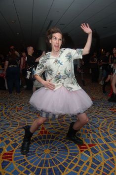 a man in a tutu dancing on the floor