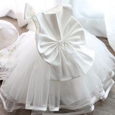 Spring Baptism Tutu Dress With Bow, Sleeveless Princess Dress With Bow For Birthday, Sleeveless Dress With Bow For Birthday, Spring Princess Dress With Bow For Dress-up, White Tutu Dress With Bow For Birthday, Fitted Baptism Dress With Bow, Spring Wedding Princess Dress With Bow, Summer Tutu Dress With Bow For Baptism, Summer Baptism Tutu Dress With Bow