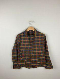 *ITEM: 45rpm plaid tartan mandarin style jacket checked plaid tartan checkered wool medium Woolen jacket brown jacket size M              *ITEM DETAILS: 👇🏻 Please be aware that all vintage items will usually show a few signs of wear or fading due to age, but anything visible such as stains or holes, and serious flaws have been photographed.For any further information on this item please contact us and we will be happy to help. *SIZE: MEDIUM * ACTUAL SIZE MEASUREMENT: 👇🏻 *PIT TO PIT(WIDTH):21 Plaid Flannel Outerwear With Long Sleeves, Casual Plaid Wool Outerwear, Wool Button-up Flannel Shirt For Fall, Fall Wool Button-up Flannel Shirt, Wool Flannel Button-up Shirt For Fall, Brown Button-up Tweed Jacket For Winter, Winter Plaid Flannel Shirt With Button Closure, Wool Long Sleeve Flannel Shirt With Button Closure, Plaid Single Breasted Shacket For Winter