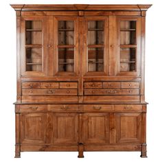 an old wooden cabinet with glass doors and drawers on the front, isolated against a white background