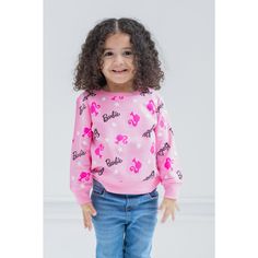 Your little girl is ready to play with her favorite dolls in this cute Barbie sweatshirt. This stylish pink pullover sweater features an all-over print of stars and the iconic Barbie logo and icon. Made of a soft material that keeps your little girl comfortable, this cozy Barbie sweatshirt is part of the perfect outfit for a fun day. BARBIE (R) and associated trademarks and trade dress are owned by, and used under license from, Mattel. (c) 2022 Mattel. Pink Crew Neck Top With Star Print, Pink Character Print Top For Winter, Playful Pink Cotton Sweatshirt, Pink Character Print Tops For Winter, Cute Pink Sweater With Letter Print, Cute Pink Letter Print Sweater, Winter Pink Tops With Character Print, Cute Pink Sweater With Cartoon Print, Playful Pink Crew Neck Sweater