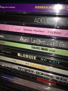 a stack of cds sitting on top of each other