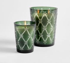 two green candles sitting next to each other