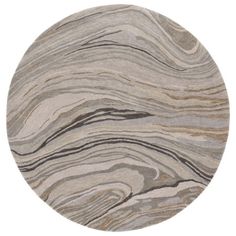 a round rug with an abstract design in grey and beige colors on the inside of it