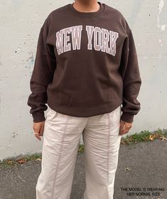 This brown crewneck New York sweatshirt is a trendy addition to your closet! This sweatshirt is so cozy and oversized that you won't want to take off! Cute, comfortable and trendy -- a necessity for any aesthetic clothing collection! The material is the classic gildan medium weight hoodie material that we all know and love.  * Graphic is a high quality digital print which is durable and long lasting! * 50% cotton / 50% medium weight poly fabric blend * Wash and dry normally (on cool for best res Oversized Y2k Sweatshirt With Letter Print, Y2k Oversized Letter Print Sweatshirt, Oversized Y2k Sweatshirt For Fall, Y2k Oversized Crew Neck Top, Oversized Y2k Crew Neck Top, Y2k Style Relaxed Fit Winter Sweatshirt, Y2k Graphic Print Sweatshirt For Fall, Y2k Fall Sweatshirt, Cozy Crew Neck Streetwear Top