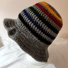 Bucket Hat Multicolor Handknit Bright Colorful Rainbow Adult Size. Original One Of A Kind Harry Styles Look A Like, Rugby Stripe Style This Is A Brand New Item. Shades Of Red, Green, Blue, Yellow, White, Black, And Grey Gray Gray Knit Beanie Hat, Casual Gray Crochet Hat For Cold Weather, Casual Gray Hat For Cold Weather, Multicolor Bucket Hat For Fall, Gray Crochet Winter Hat, One Size, Gray Winter Crochet Hat One Size, Gray One Size Crochet Winter Hat, Casual Black Slouchy Crochet Hat, Casual Gray Knit Hat