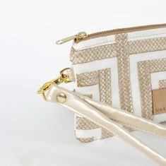 Get ready for a taste of luxury and style with this geometric clip pouch. Its slim profile makes it easy to slip into your pocket and it still has plenty of room for your ID and cards. Make it fancy by attaching the removable wristlet strap and rock it on its own. Handcrafted by our team of women artisans in recovery, 100% of your purchase goes to provide job skills training and career development for the women who made it. Details 100% upcycled materials Dimensions: 5" x 4" Liner: Upcycled fabr Chic Rectangular Wristlet With Zipper Pouch, Chic Zipper Pouch Wristlet, Chic Rectangular Wallet With Zipper Pouch, Chic Wristlet With Zipper Pouch, Chic Rectangular Wristlet Gift, Chic Rectangular Wristlet For Gift, Chic Rectangular Wristlet For Daily Use, Chic Everyday Rectangular Wristlet, Chic Rectangular Coin Purse With Zipper