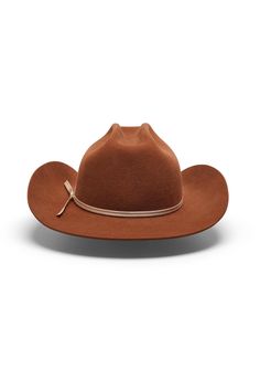 Discover Texas Tea—a warm brown cowboy hat with an unmistakable presence and refined edge. Crafted with a slightly shorter, sharply curved flanged brim, Texas Tea commands attention with its distinctive silhouette. The crown showcases a slimmer brick crease inspired by classic cattleman styling, accented with a “mule kick” at the front, while a cream 2-ply ribbon hatband adds an elegant touch. Inside, a limited-edition satin liner and leather sweatband, offer unparalleled comfort. Texas Tea is w Fitted Hat Bands For Western-themed Events, Classic Brown Fedora For Western-themed Events, Classic Brown Fedora For Western Style, Classic Brown Fedora For Ranch, Vintage Fitted Fedora For Ranch, Fitted Vintage Fedora For Ranch, Classic Brown Western Fedora, Fitted Brown Hat For Ranch, Fitted Western Brown Hat Bands