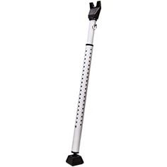 a white and black metal pole with polka dot design on the top, standing upright in front of a white background