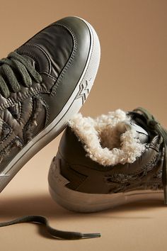 The Ash Malibu Faux-Fur Sneaker warms up the season with a plush, faux-fur lining and a chunky sole. | Malibu Faux-Fur Sneakers by Ash in Green, Women's, Size: 36, Leather/Rubber at Anthropologie Winter Streetwear Sneakers With Textured Sole, Winter High-top Sneakers With Textured Sole For Streetwear, Winter Sporty High-top Sneakers With Textured Sole, Winter Low-top Sneakers With Textured Sole, Winter Leather Sneakers, Casual Winter Sneakers With Shearling, Casual Shearling Winter Sneakers, Casual Winter Shearling Sneakers, Fur Sneakers