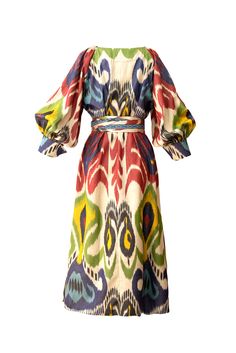 The Bahour ikat flared dress is a great special occasion dress. It features heart shaped elegant neckline and a reglan puff sleeves with a beautiful folded cuffs. The long sash with the tassels are decorated with hand-woven bands. You can wear this dress loose without the sash or with a sash to emphasize your waist. The dress has fabric covered button closure. Side pockets. 80% Silk/ 20% Cotton Length: 125cm Dry clean or hand wash with shampoo in cold water. Handmade in Uzbekistan BIBI HANUM Ikat Dress Designs, Goddess Gown, Ikat Dress, Yellow Silk, Silk Ikat, Ikat Print, Flared Dress, One Clothing, Fabric Covered Button