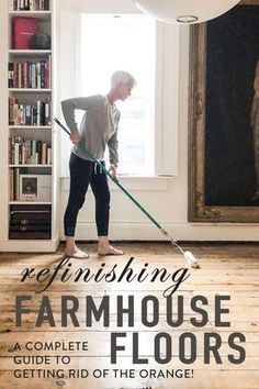 a woman sweeping the floor with a mop in front of a bookcase that reads refinishing farmhouse house floors