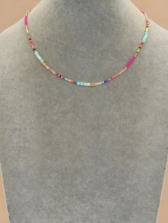 Sunshine, beach days and fun! This multi-colored beaded necklace has everything you need for effortless style while on vacation or hanging with friends in the sun! Total length: 16" with a 2" extender. Color and pattern may vary slightly. Please note: This is a final sale item and no returns or exchanges are accepted for this item. Product requires extended processing and shipping time. Cheap Handmade Festival Necklaces, Cheap Festival Strand Necklace, Handmade Cheap Festival Necklaces, Cheap Beaded Choker For Summer, Cheap Bohemian Beaded Necklaces For Summer, Cheap Strand Necklaces For Summer, Cheap Summer Strand Necklaces, Cheap Colorful Beaded Necklaces For Beach, Cheap Bohemian Beaded Necklace With Tiny Beads