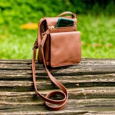 Small Leather Cross-Body Sling Bag - Bon Voyage | NOVICA On-the-go Crossbody Camera Bag With Cell Phone Pocket, Crossbody Saddle Bag With Cell Phone Pocket For On-the-go, Leather Travel Phone Shoulder Bag, Leather Shoulder Bag With Mobile Phone Holder For Travel, Leather Shoulder Phone Bag For Travel, Leather Phone Bag For Everyday Use, Versatile Crossbody Saddle Bag For Travel, Leather Mobile Phone Shoulder Bag For Travel, Crossbody Phone Bag For Travel