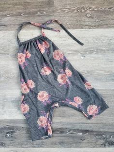 These adorable rompers are made from soft lightweight jersey blend fabrics for comfort during those hot summer days. The rompers have a halter top tie at the back of the neck and a functional side pocket.  Pictured in the photos are sizes 1T (peach with anchors) and 2T (navy, leaves on navy) and 3T (grey floral) for comparison purposes.  Approximate measurements for our rompers (with allowances for difference fabric/print stretches) are as follows:                                   1 T Dusty Rose Pink, Leg Cuffs, Pink Floral Print, Halter Tops, Top Summer, Fabric Print, Floral Baby, Grey Floral