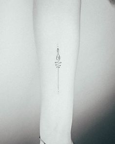 a person's arm with a tattoo on the left side of their body and an arrow in the middle