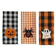 three halloween napkins with different designs on them