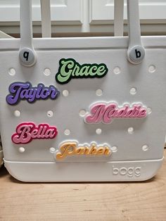 Personalize your beach bags and totes with these retro style font name plates! Fully customizable, you can pick your text, base/background color, and font color! I also offer two different sizes of charms so pick whichever fits the layout of your bag the best! Size simply impacts how large the font and charm is. it does not affect what type or size of bag you can put it on, so just pick whether you would like the charm to look bigger or smaller on your bag! Extremely easy to install! Utilizing a screw and socket system, just insert the charm socket into the desired hole on your bag and screw the custom printed screw into the socket on the charm. This insures a tight fit to your bag so the charm does not fall off or spin when in use! Each charm is 3D printed from a material called PLA. PLA Customizable Green Bags For Personalized Gifts, Personalized Multicolor Trendy Bag, Personalized Trendy Multicolor Bag, Trendy Personalized Multicolor Bag, Fun Personalized Everyday Bags, Fun Personalized Bags, Fun Everyday Personalized Bags, Customizable Fun Pink Bags, Personalized Trendy White Bags