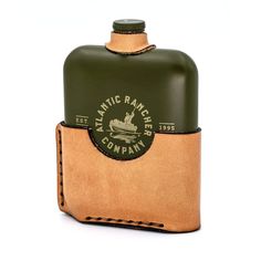 a leather flask with a green and tan cover