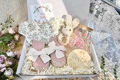 a gift box filled with pink and white items