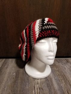 Crocheted super slouchy beanie in red, black, grey, and white worked from the top down in acrylic yarns. The width tapers from the top to the band, where the black and red yarns are doubled. Crutch Covers, Crochet Slouch Beanie, Crutch Pad, Slouch Beanie Hats, Slouch Beanie, Rainbow Crochet, Red Yarn, Slouchy Beanie, Purple Glass