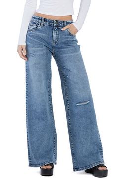 Floor-sweeping wide legs bring a stunningly chic look to these lightly distressed high-rise jeans made with a hint of shape-retaining stretch. 32" inseam; 24" leg opening; 10 1/2" front rise (size 27) Zip fly with button closure Five-pocket style 67% cotton, 29% REPREVE® recycled polyester, 3% rayon, 1% spandex REPREVE recycled polyester is made from 100% post-consumer recycled plastic bottles Machine wash, tumble dry Imported Chic Distressed Medium Wash Flare Jeans, Fall Distressed Wide Leg Bottoms, Ripped Dark Wash Wide Leg Flare Jeans, Distressed Wide Leg Flare Jeans In Medium Wash, Chic Distressed Mid-rise Flare Jeans, Chic Mid-rise Distressed Flare Jeans, Distressed Denim Blue Full-length Flare Jeans, Distressed Denim Blue Full Length Flare Jeans, High Waist Distressed Washed Blue Flare Jeans