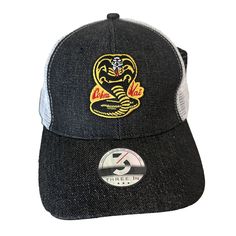 New With Tags Cobra Kai Trucker Hat From Three In Size: One Size Color: Black Denim Adjustable Snapback Strap Mid-Profile Height Pre-Curved Visor Twill/Poly Mesh One Size Fits Most 6-Panel Flexible Fitted Cap Seamed Front Panel With Full Buckram 2 Sewn Eyelets Pro Stitch On Crown 6 Rows Stitching On Visor Black Fitted Baseball Cap Casual, Black Fitted Casual Baseball Cap, Casual Fitted Baseball Cap With Curved Bill, Black Fitted Baseball Cap With Short Brim, Fitted Casual Snapback Hat, Fitted Casual Snapback Baseball Cap, Black Fitted Snapback Hat, Fitted Casual Visor Hat, Black Fitted Casual Hat