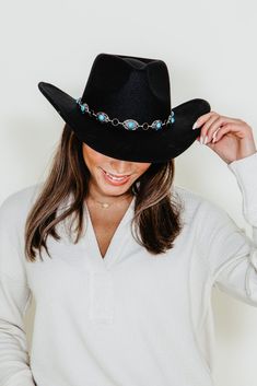 Saddle up in style with this C.C. Felt Silver and Turquoise Trim Cowgirl Hat for Women in Black. The classic western design is accented with a sparkling silver and turquoise hatband for a look that's sure to turn heads! Great for stepping out in style at your next event. Yee- haw! Features: C.C. Style: VCE0062BLK Color: Black Women's hat Western design Silver and turquoise hatband Felt fabric Band on inside trim with drawstrings Wired brim so it stays in place Measurements: 3" Brim, 18" Diameter Western Hats For Women, Hat Bar, Women In Black, Cc Beanie, Black Cowboy, Cowboy Party, Cowgirl Hat