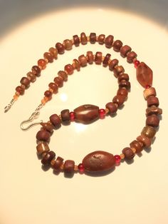 A beautiful collection of very old ancient Carnelian Beads , Carnelian Beads, . They are found in Afghanistan, India, Pakistan and Tibet. They can be used to make a beautiful contemporary designed necklaces. Each bead is authentic and old. Highly collectible 9 pictures are there you can swipe each to see all pictures silver lock 95.5with the necklace Artisan Carnelian Beaded Necklaces, Artisan Brown Beaded Necklace With Oval Beads, Handmade Carnelian Beads For Jewelry Making, Brown Carnelian Beaded Jewelry, Artisan Brown Beaded Necklaces With Oval Beads, Unique Amber Carnelian Beaded Necklaces, Handmade Amber Carnelian Beaded Necklaces, Artisan Agate Jewelry With Wooden Beads, Agate Jewelry With Round Wooden Beads