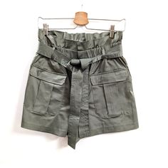 High-Waisted Shorts With Paperbag Waistband. Front Patch Pockets With Flaps. Self-Belt With Bow. Front Zip And Metal Hook Closure Hidden By A Flap. Color: Sage Green Paperbag Waist Bottoms With Built-in Shorts For Day Out, High Waist Utility Shorts With Belt Loops, Utility High Waist Shorts With Belt Loops, Chic High Waist Shorts, Chic High Waisted Shorts With Waistband, Chic High Waist Shorts With Waistband, Casual Paperbag Waist Belted Bottoms, Casual Belted Bottoms With Paperbag Waist, Casual Belted Paperbag Waist Bottoms