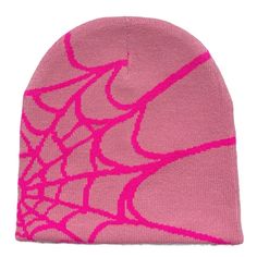 a pink beanie with spider webs on it