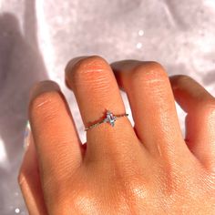 This iridescent ring is something you'll always treasure. We love this dainty ring so much! It's the perfect ring to add to your stack or wear alone when you want to serve some dainty elegance. 18k gold plated, 18k rose gold plated, or rhodium plated over brass with a protective coating Cubic zirconia stones Approx 7mm ring face Available in sizes 6-8 Shop our entire In the Garden Collection here Dainty Midi Rings For Gifts, Dainty Promise Stackable Open Rings, Hypoallergenic Delicate Midi Rings, Dainty Adjustable Midi Rings For Promise, Dainty Rose Gold Stackable Crystal Ring, Dainty Solitaire Rose Gold Stackable Rings, Delicate Hypoallergenic Midi Rings For Promise, Delicate Hypoallergenic Midi Promise Ring, Dainty Stackable Moonstone Ring For Promise