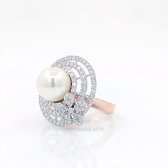 Item Code LR00008 Metal Type Rose Gold Metal Karat 14 kt Diamond Natural Diamond Shape Round,Freshwater Pearl Diamond Ct 1.64 ct Diamond Color FG Diamond Clarity SI+ This elegant ring features a combination of a Freshwater pearl and round cut natural diamonds, set in a heavy floral pattern design. The ring is crafted from 14 k gold, and has a high-polish finish that makes it shine like no other. The freshwater pearl is placed at the center of the ring, surrounded by a halo of round cut natural d Gia Certified Rose Gold Diamond Jewelry, Elegant Gia Certified Rose Gold Diamond Ring, Luxury Rose Gold Diamond Pearl Ring, Gia Certified Rose Gold Round Jewelry, Rose Gold Gia Certified Jewelry For Wedding, Rose Gold Gia Certified Wedding Jewelry, Fine Jewelry Pearl Ring With Diamonds In Rose Gold, Rose Gold Gia Certified Jewelry, Gia Certified Rose Gold Jewelry