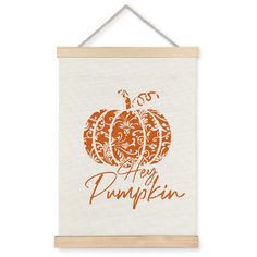 a white wall hanging with an orange pumpkin and the words, happy pumpkin on it