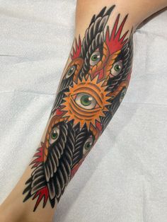 a person with an all seeing tattoo on their leg