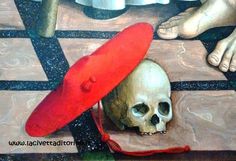 a painting of a human skull with a red hat on the floor next to it