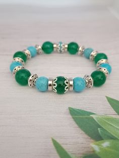 Handmade Women's Bracelet Women's Bracelet - Green and Turquoise Beaded Bracelet, Women's Bead Bracelet, Beaded Bracelet, Bracelets for Women FOLLOW US Instagram: https://www.instagram.com/rlewiscreations Twitter: https://twitter.com/rlewiscreations Facebook: https://www.facebook.com/rlewiscreations Turquoise Crystal Bracelet With 8mm Beads As Gift, Gift Turquoise Crystal Bracelet With 8mm Beads, Adjustable Turquoise Jade Beaded Bracelets, Turquoise Stretch Bracelet With Round Beads As Gift, Turquoise Stretch Bracelet With Round Beads For Gift, Turquoise Jade Beaded Bracelets With Round Beads, Turquoise Crystal Bracelet With Spacer Beads As Gift, Turquoise Crystal Bracelet With Spacer Beads For Gifts, Turquoise Stretch Bracelet With Gemstone Beads As Gift