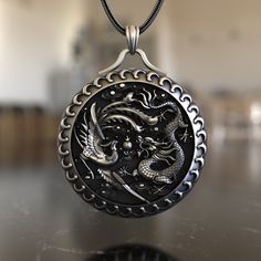 Behold the mesmerizing dance of the Dragon and Phoenix in this 925 Sterling Silver Necklace. Drawing inspiration from ancient tales, this pendant captures the essence of two mythical creatures representing power, rebirth, and balance. Handcrafted with intricate details, the Dragon and Phoenix coil gracefully, their forms beautifully contrasting and complementing each other, symbolizing unity in duality. The polished silver adds a touch of elegance, making this necklace a standout piece. Perfect Necklace Dragon, Necklace Drawing, Dragon Phoenix, Silver Necklaces Women, Gothic Necklace, Mens Silver Necklace, Handcrafted Artisan Jewelry, Medallion Necklace, Pet Necklace