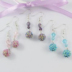 Sparkly Crystal and Disco Ball Beaded Hook Earrings      Available in pink, blue or purple   Select your preference from the drop down box above       Materials:     Earring Hooks - Iron   Dangles - Crystal, Polymer Clay and Rhinestone           Approx. Total Earring Length:  47mm Crystal Polymer Clay, Disco Ball Earrings, Cat Earrings Studs, Boho Chic Jewelry, Ball Earrings, Glitter Earrings, Earring Hooks, Disco Ball, Earrings Collection