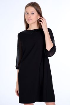 "Our 60s inspired simple elgance dress cut in A- line silhouette, above the knee length and sheer 3 4 sleeves.  The black glitter lace trim beautifully at the neckline. Handcrafted from fabric with excellent drape and durability.  Our model is 172 cm and wears EU size 36. To be sure, please choose one size up. Details & Composition: * 74% polyester, 26& viscose- fabric OEKO-tec certified 1000 * 3/ 4 sheer sleeves * Crew neck with glitter band * Hidden zip 20cm back Washing instructions: 30o fine wash, do not tumble Please check the actual size measurements before purchasing. Size 34 (XS) (US S 0-2, UK 4-6, Italian 36-38, French 32-34) Bust: fits bust around 31.5\"-80 cm Waist: fits waist around 26\"- 66 cm Hips: fits hips around 35,4\"- 90 cm Size 36 (S) (US S 2-4, UK 6-8, Italian 38-40, F Formal Elegant Half Sleeve Mini Dress, Elegant Formal Mini Dress With Half Sleeves, Elegant Half Sleeve Mini Dress For Formal Occasions, Elegant Formal Half Sleeve Mini Dress, Chic Half-sleeve Midi Party Dress, Elegant Party Dresses With 3/4 Sleeves, Elegant Half Sleeve Mini Dress, Elegant Evening Dress With 3/4 Sleeves, Elegant 3/4 Sleeve Evening Dress