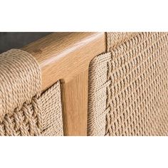 close up view of the side of a chair with roped wood trimmings