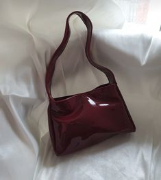 ✨ Elevate your style with our Burgundy Elegance handbag! ✨ Crafted from luxurious patent leather, this stunning accessory seamlessly combines sophistication with a touch of modern flair. The deep burgundy hue exudes confidence and versatility, making it the perfect companion for any occasion. 🌟 🎁 Perfect Gift: Surprise a special woman in your life with the Burgundy Elegance handbag - a timeless and elegant gift that will leave a lasting impression. Carry sophistication wherever you go with our Burgundy Elegance handbag. Embrace the confidence that comes with a stylish accessory that complements your unique personality. Order yours now and make a statement in every stride! 👜✨ Hello, Thank you for choosing to shop with us on Etsy! We appreciate your support and are thrilled to be able to Large Capacity Red Rectangular Baguette Bag, Rectangular Large Capacity Hobo Bag For Party, Trendy Square Baguette Bag For Parties, Trendy Red Baguette Bag For Everyday Use, Trendy Burgundy Shoulder Bag With Large Capacity, Retro Burgundy Shoulder Bag, Trendy Red Tote Baguette Bag, Trendy Burgundy Rectangular Satchel, Retro Burgundy Satchel Shoulder Bag